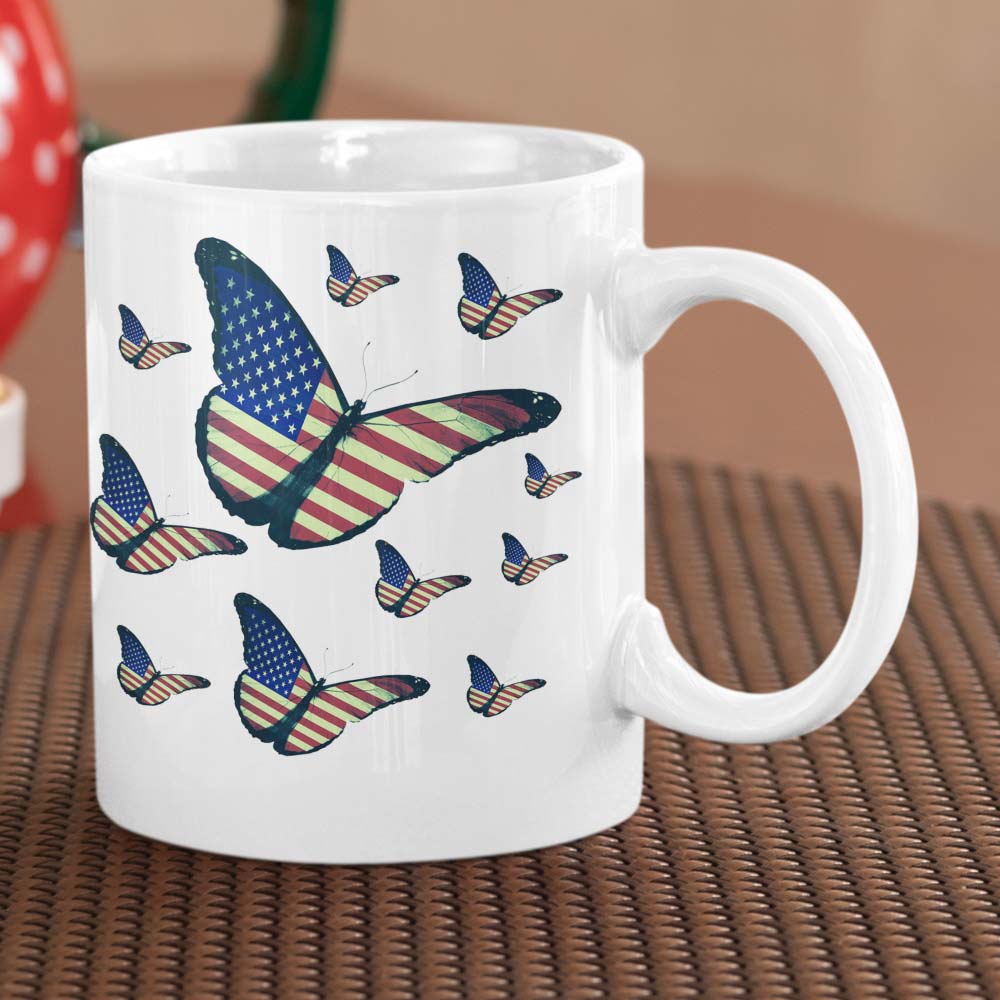 Patriotic mug with intricate butterfly and flag artwork