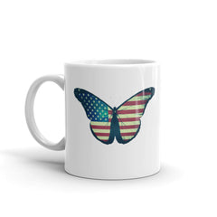 This high-quality ceramic mug showcases a vibrant, detailed image of a butterfly gracefully adorned with the stars and stripes of the American flag. 