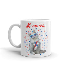 This whimsical mug features an adorable feline wearing patriotic glasses, surrounded by a constellation of stars, creating a truly captivating design. 