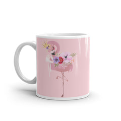 Made from high-quality ceramic, this mug showcases a charming pink flamingo surrounded by vibrant flowers, bringing a touch of tropical paradise to your morning cuppa. 